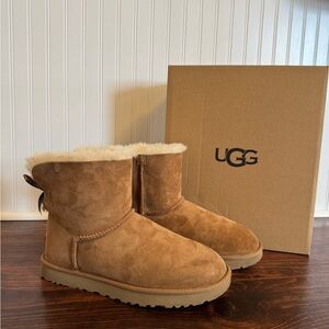 UGG Women’s Mini Bailey Bow II Boots in Chestnut